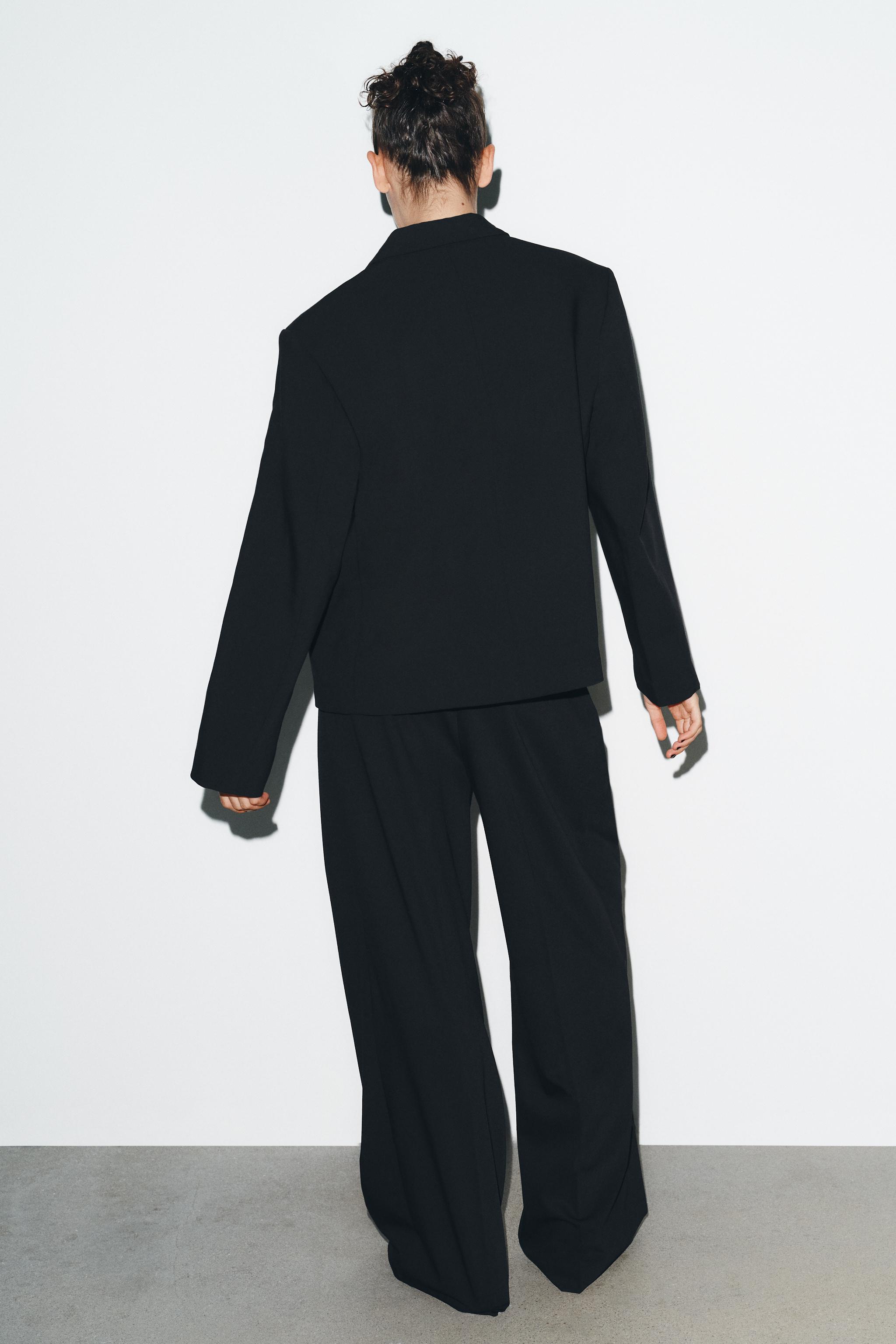 PINSTRIPE PANTS WITH PLEATS AND FLAPS